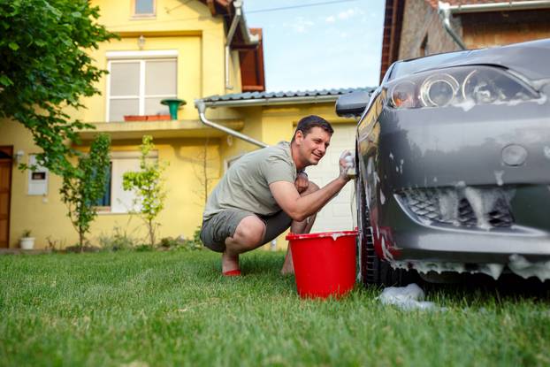 Car,Washing.,Smiling,Man,His,Cleaning,Car,Using,Sponge,And