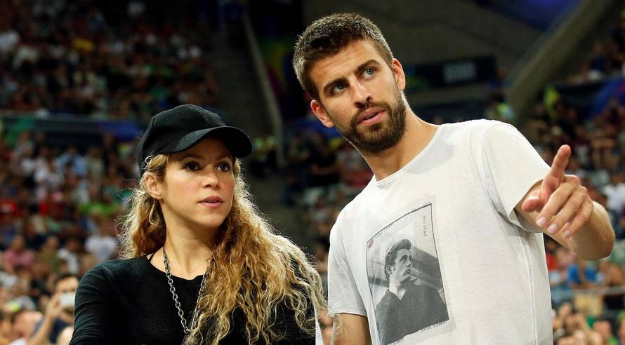 FILE PHOTO: Colombian singer Shakira and her partner, Barcelona soccer player Pique, attend the Basketball World Cup quarter-final game between the U.S. and Slovenia in Barcelona