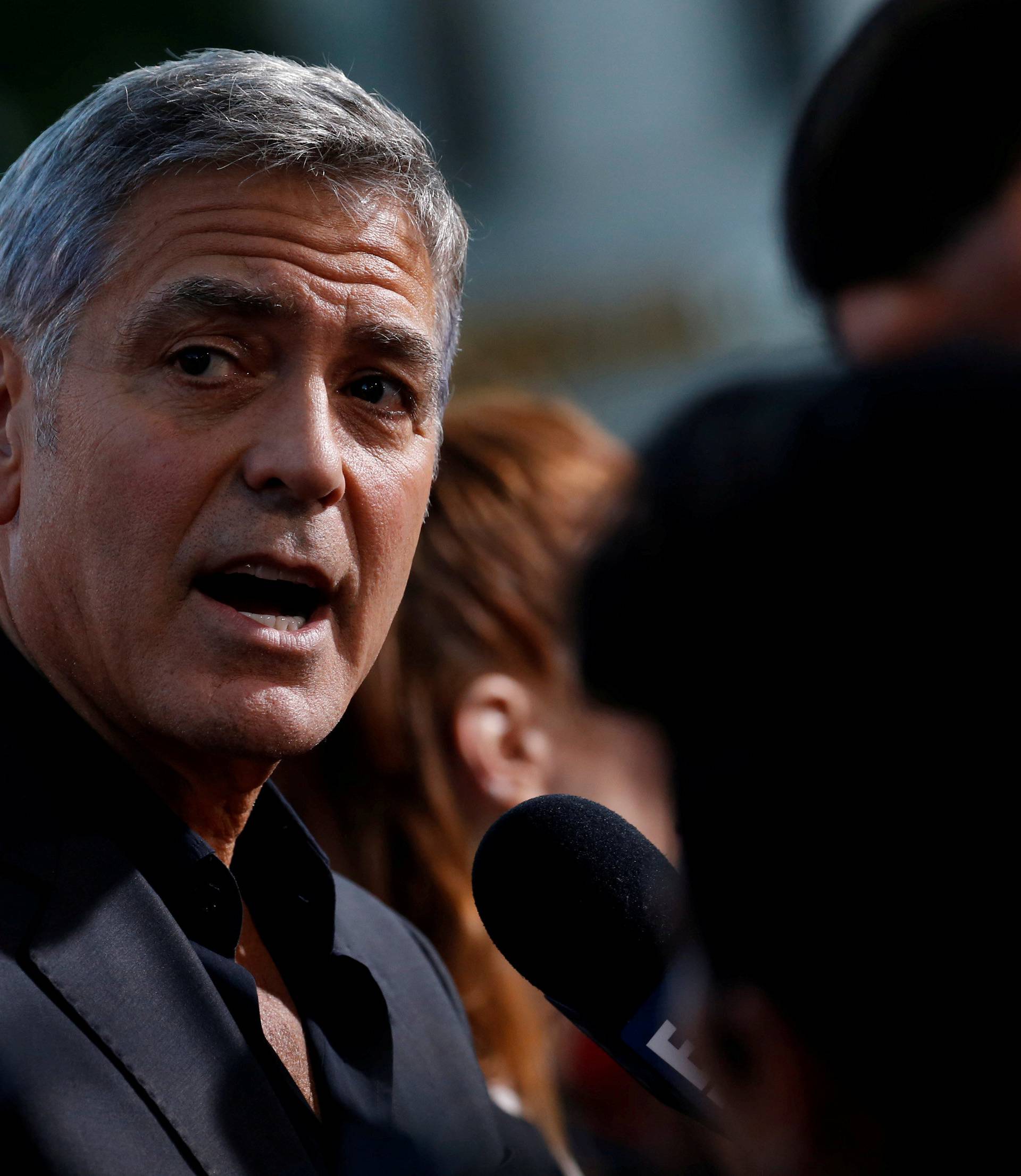 FILE PHOTO: Director Clooney is interviewed at the premiere for "Suburbicon" in Los Angeles