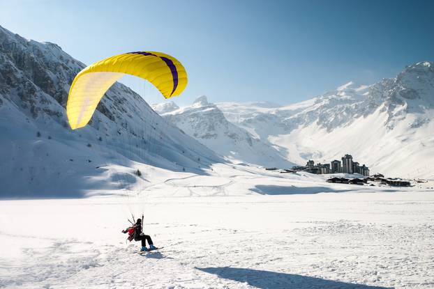 Paraglider,Landing,On,Skis,In,Tignes,,A,Ski,Resort,In