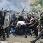 NATO Kosovo Force (KFOR) soldiers clash with local Kosovo Serb protesters in the town of Zvecan