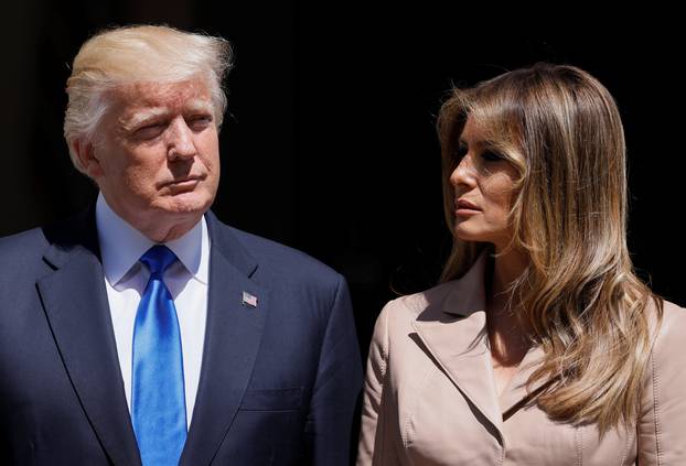 U.S. President Trump and first lady Melania Trump wait the arrival of French President Macron before a lunch ahead of a NATO Summit in Brussels