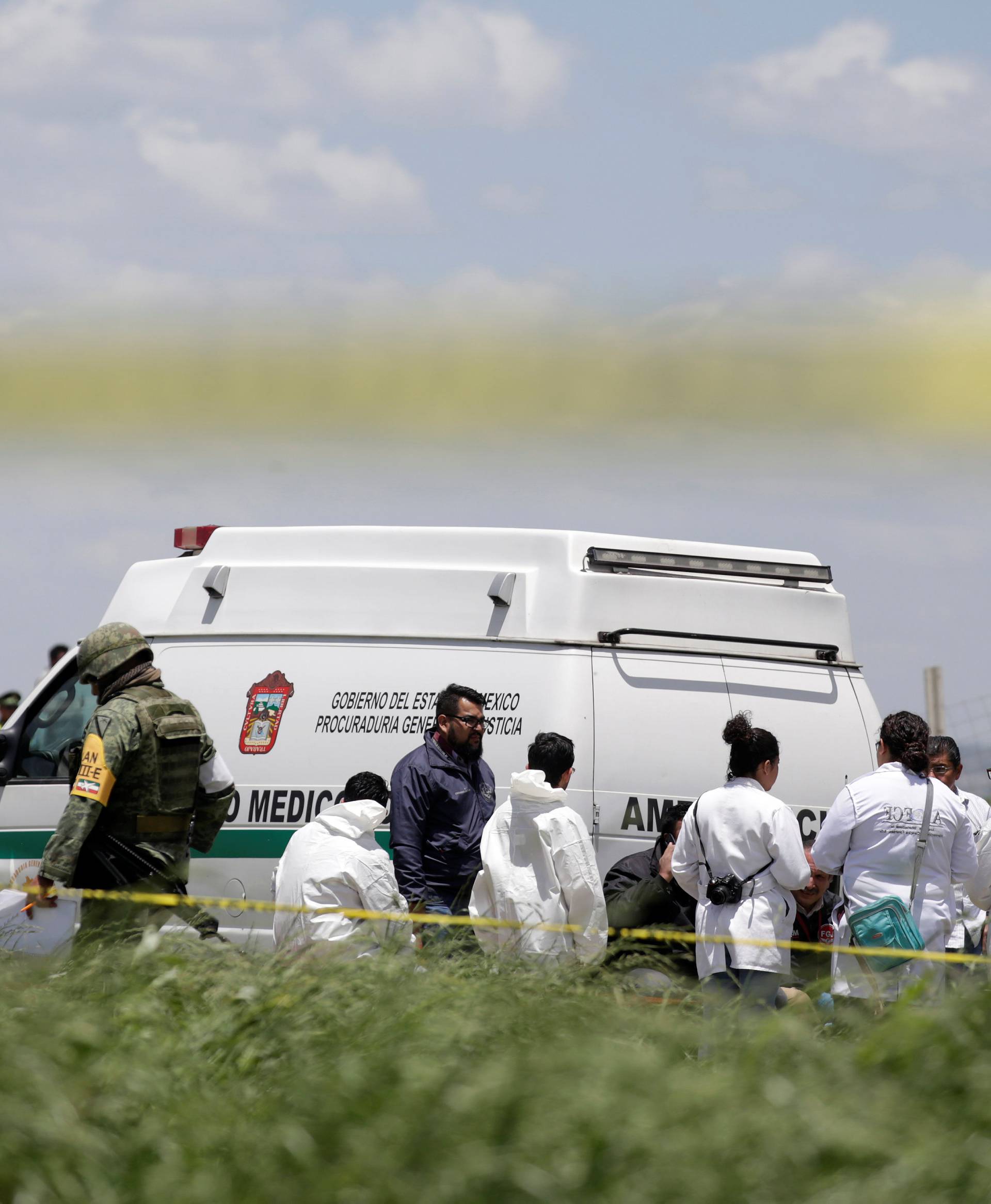 Forensic technicians are seen at a site damaged due to fireworks explosions in the municipality of Tultepec