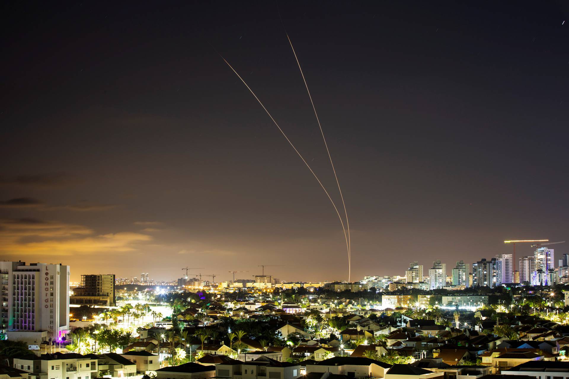 Streaks of light are seen as Israel's Iron Dome anti-missile system aims to intercept rockets launched from the Gaza Strip towards Israel, as seen from Ashkelon, Israel