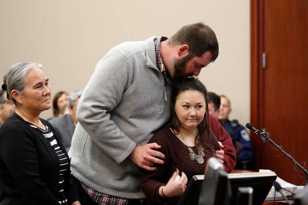 Victim Anya Gillengerten is comforted by her boyfriend as she speaks at the sentencing hearing for Larry Nassar, a former team USA Gymnastics doctor who pleaded guilty in November 2017 to sexual assault charges, in Lansing, Michigan