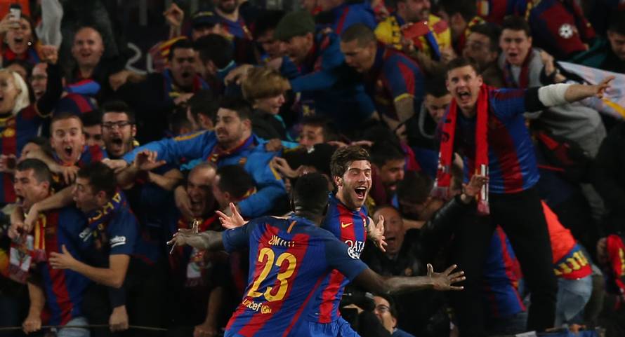 Barcelona's Sergi Roberto celebrates scoring their sixth goal with Samuel Umtiti