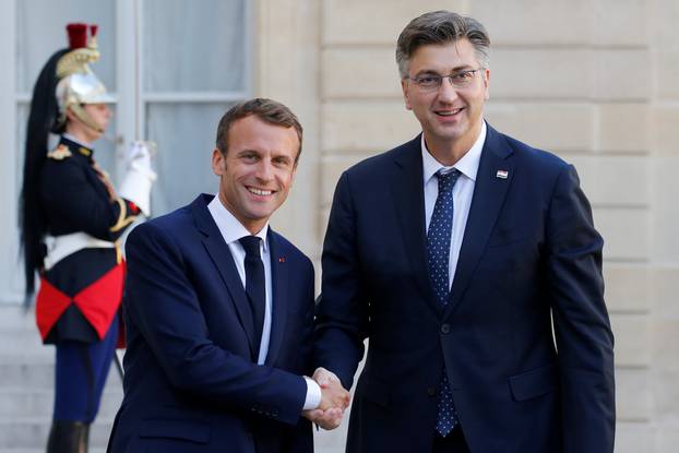 French President Emmanuel Macron welcomes Croatian Prime Minister Andrej Plenkovic at the Elysee Palace in Paris