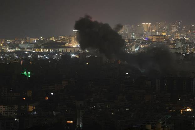 Smoke rises after Israeli strikes on Beirut's southern suburbs, following an escalation between Hezbollah and Israel amid the U.S.-Israeli conflict with Iran