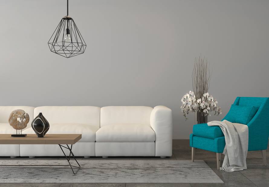 Turquoise armchair with a sofa in the living room