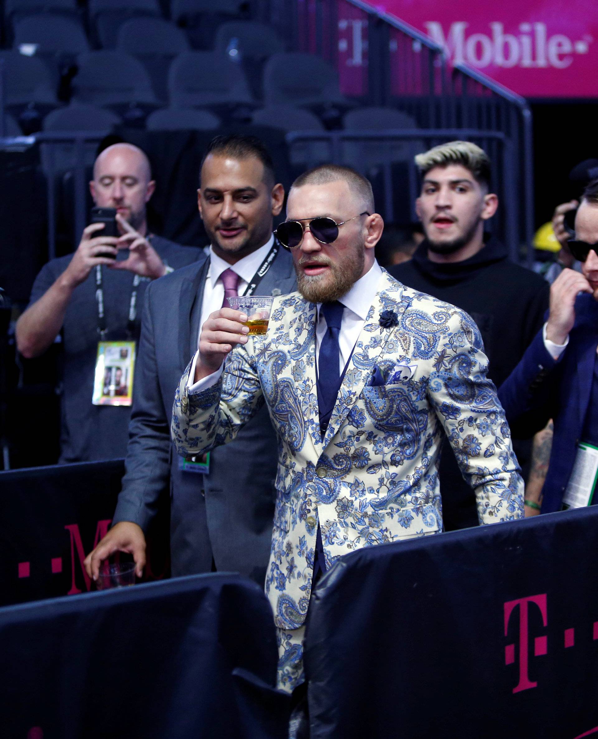 UFC lightweight champion Conor McGregor of Ireland arrives for a post-fight news conference at T-Mobile Arena in Las Vegas