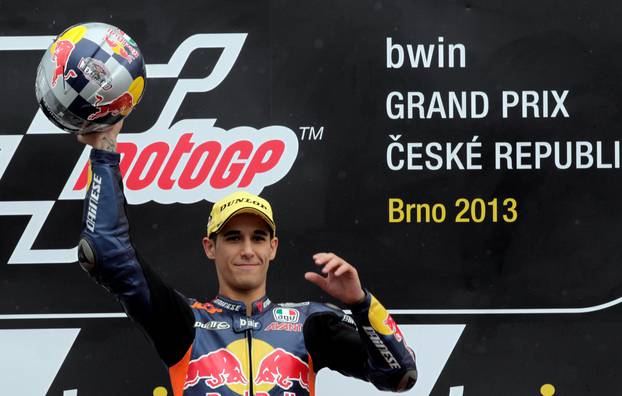 KTM Moto3 rider Salom of Spain celebrates with the trophy after winning in the class race during the Czech Grand Prix in Brno