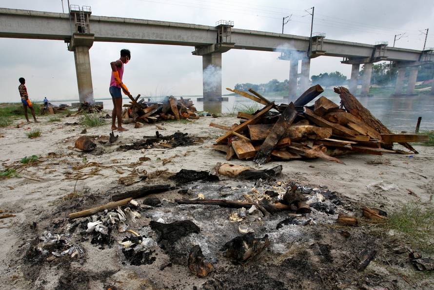 Monsoon exposes bodies buried in shallow sand graves in Phaphamau