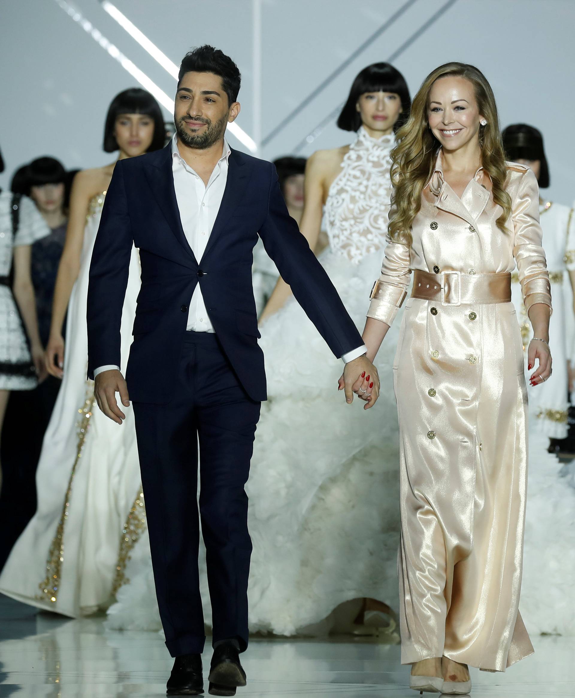 Australian designers Tamara Ralph and Michael Russo appear at the end of their Haute Couture Spring/Summer 2017 fashion show for Ralph & Russo in Paris