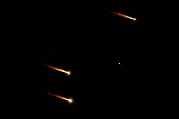 Rockets fly in the sky, amid cross-border hostilities between Hezbollah and Israel, as seen from Tel Aviv