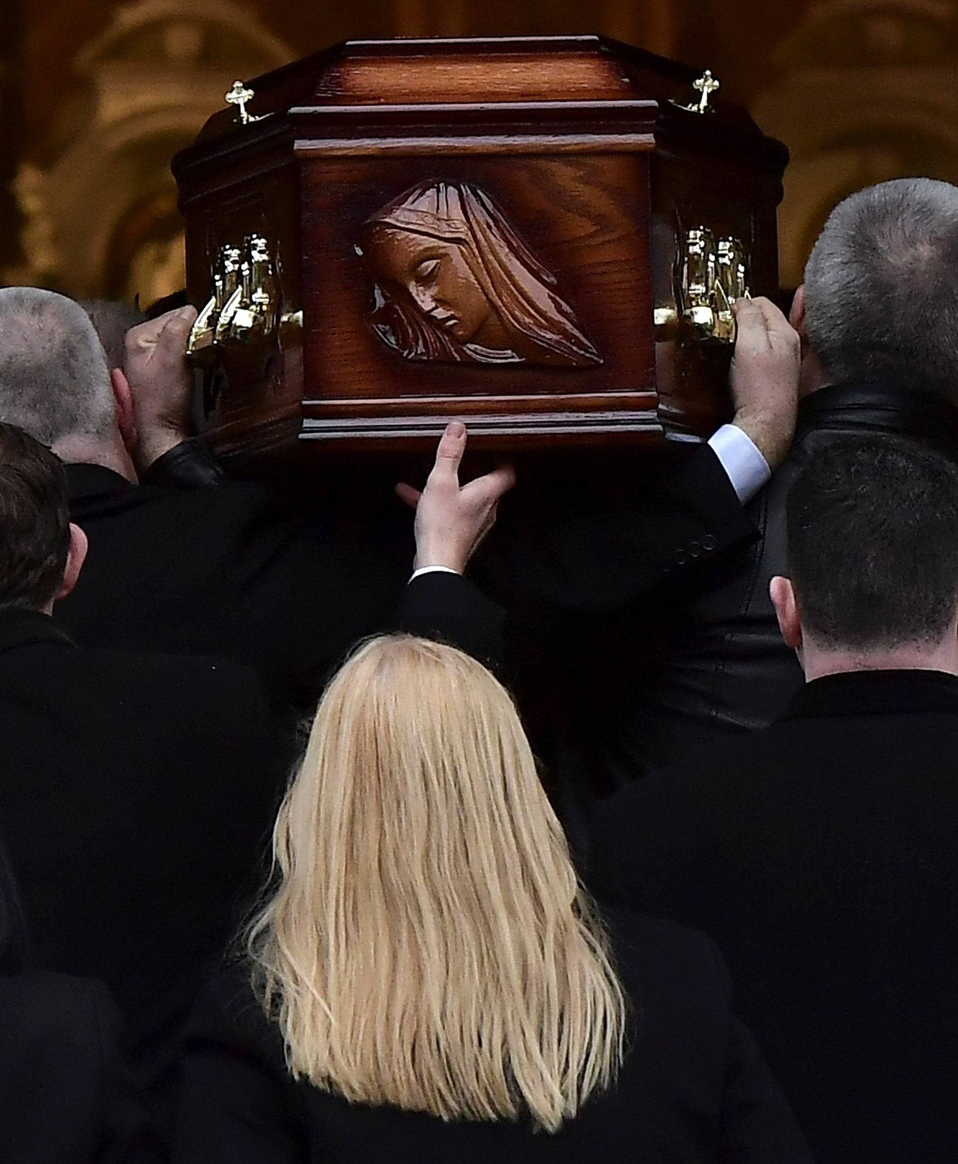 The mother of Cranberries singer Dolores O'Riordan, Eileen O'Riordan follows her daughter's coffin into St. Joseph's Church for a public reposal in Limerick