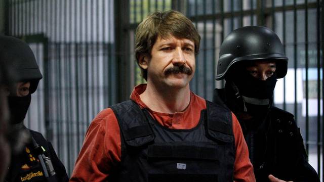 FILE PHOTO: Suspected Russian arms dealer Viktor Bout is escorted by members of a special police unit after a hearing at a criminal court in Bangkok
