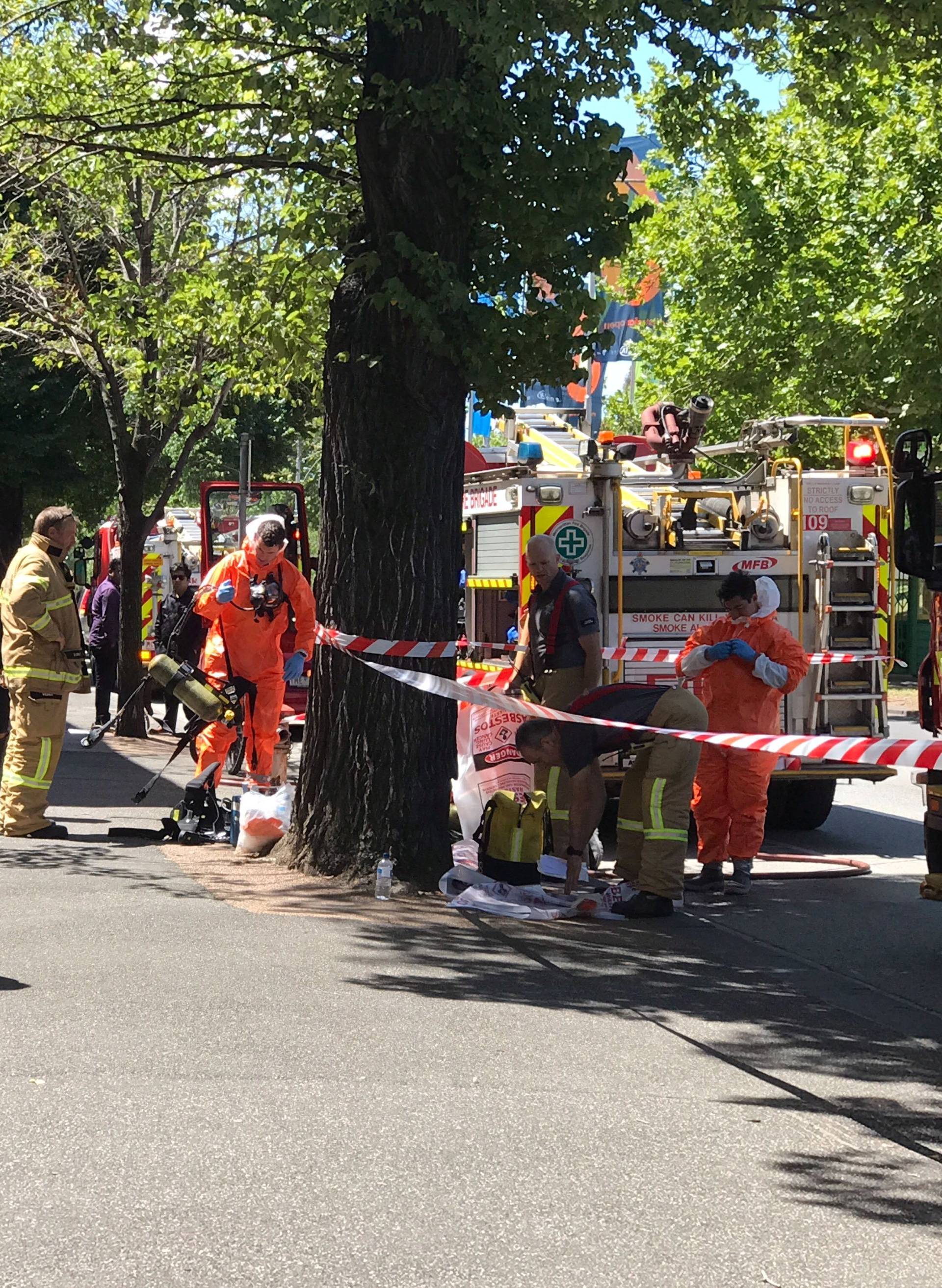 Hazmat and fire crews are seen outside the Indian and French Consulates on St Kilda Road in Melbourne
