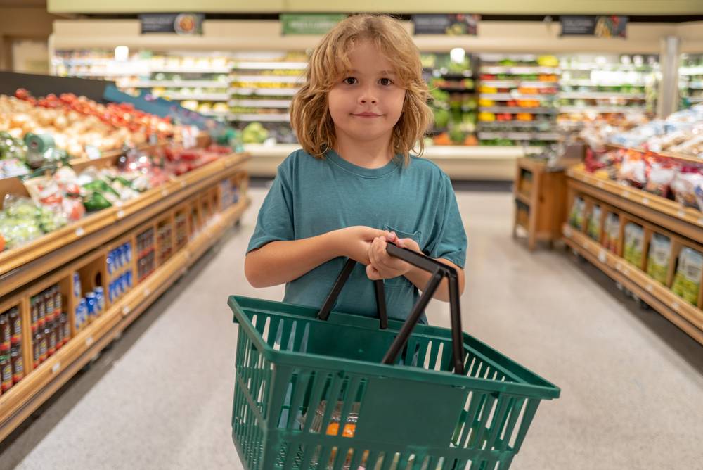 Child,With,Shopping,Basket.,Kid,In,A,Food,Store,Or