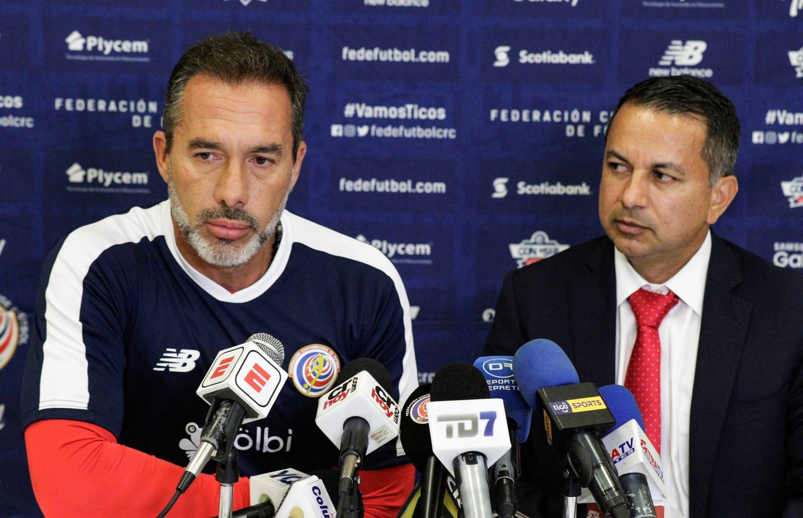 Costa Rica's national team coach Gustavo Matosas speaks next to Rodolfo Villalobos, president of the Costa Rican Soccer Federation, after announcing his resignation at the National Stadium in San Jose