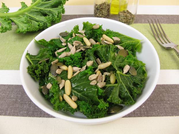 Kale salad with sunflower seeds, pine nuts, pumpkin seeds