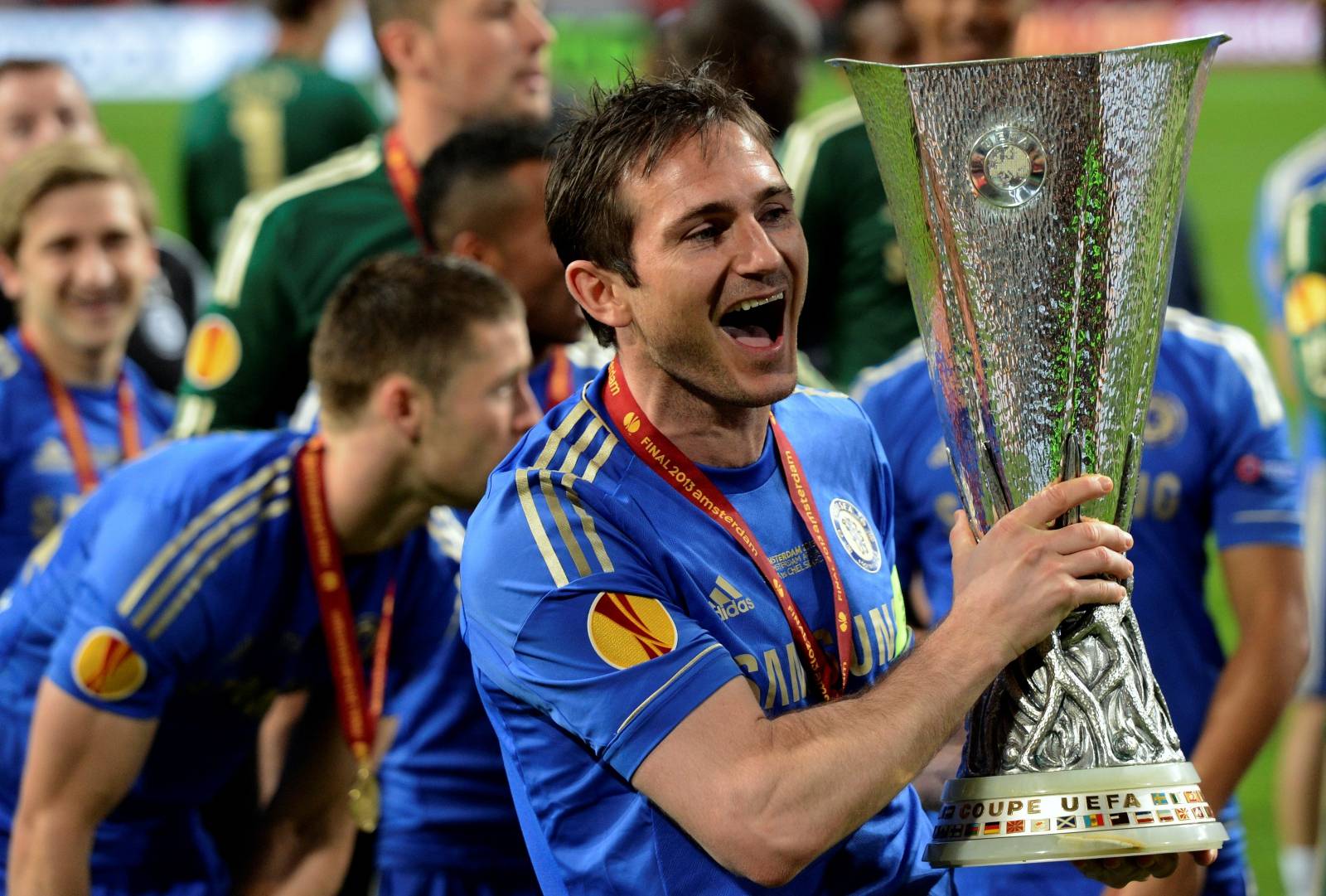 FILE PHOTO: Chelsea player Frank Lampard holds the trophy after defeating Benfica in the Europa League final soccer match at the Amsterdam Arena
