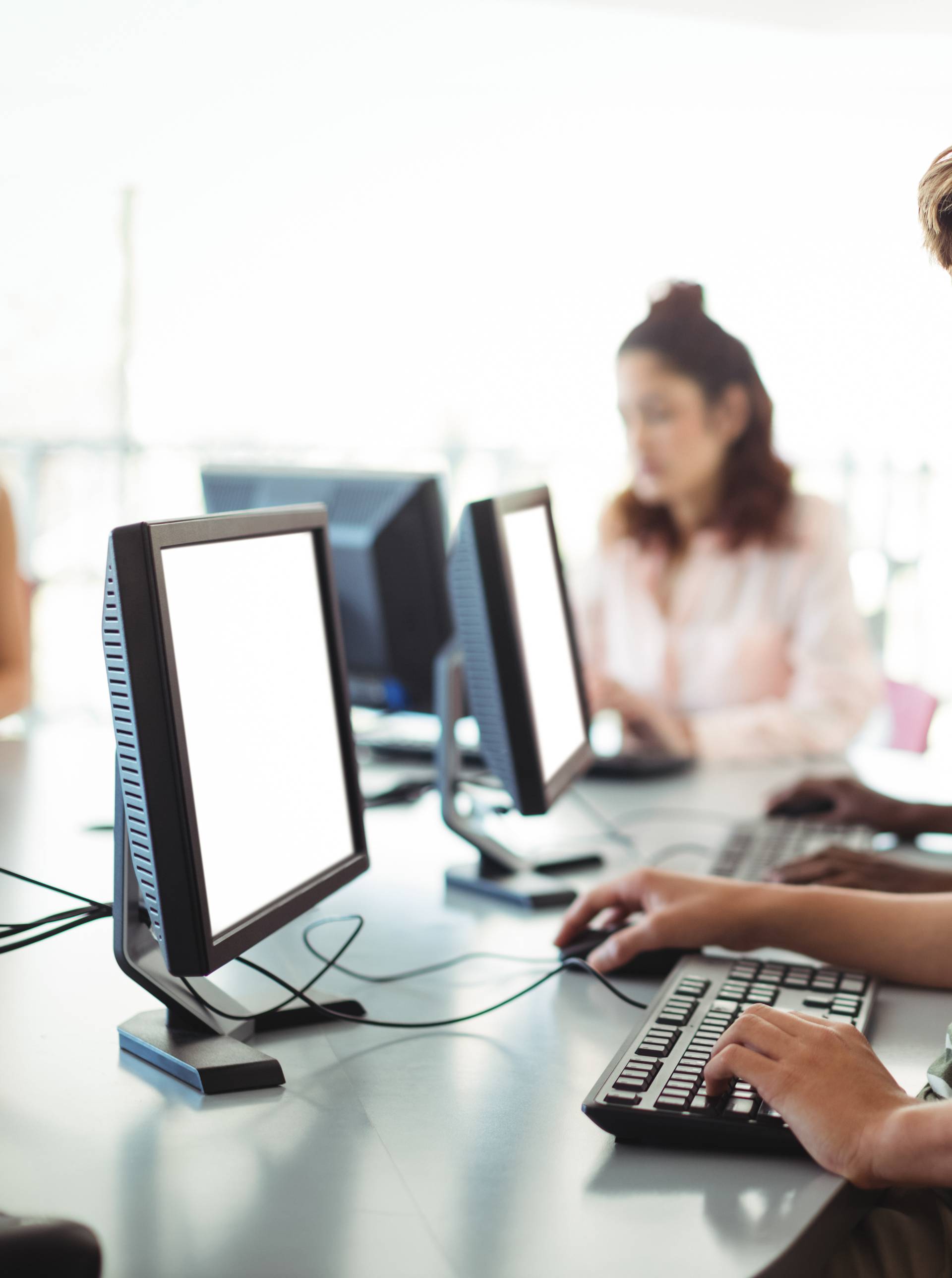 Student using computer in classroom