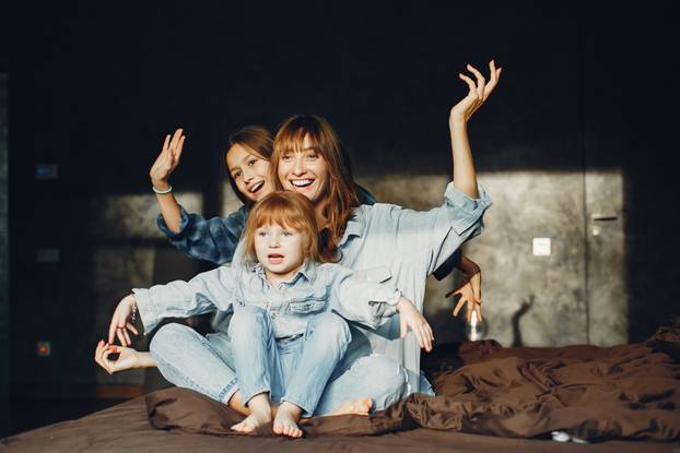 Mother with daughters at home
