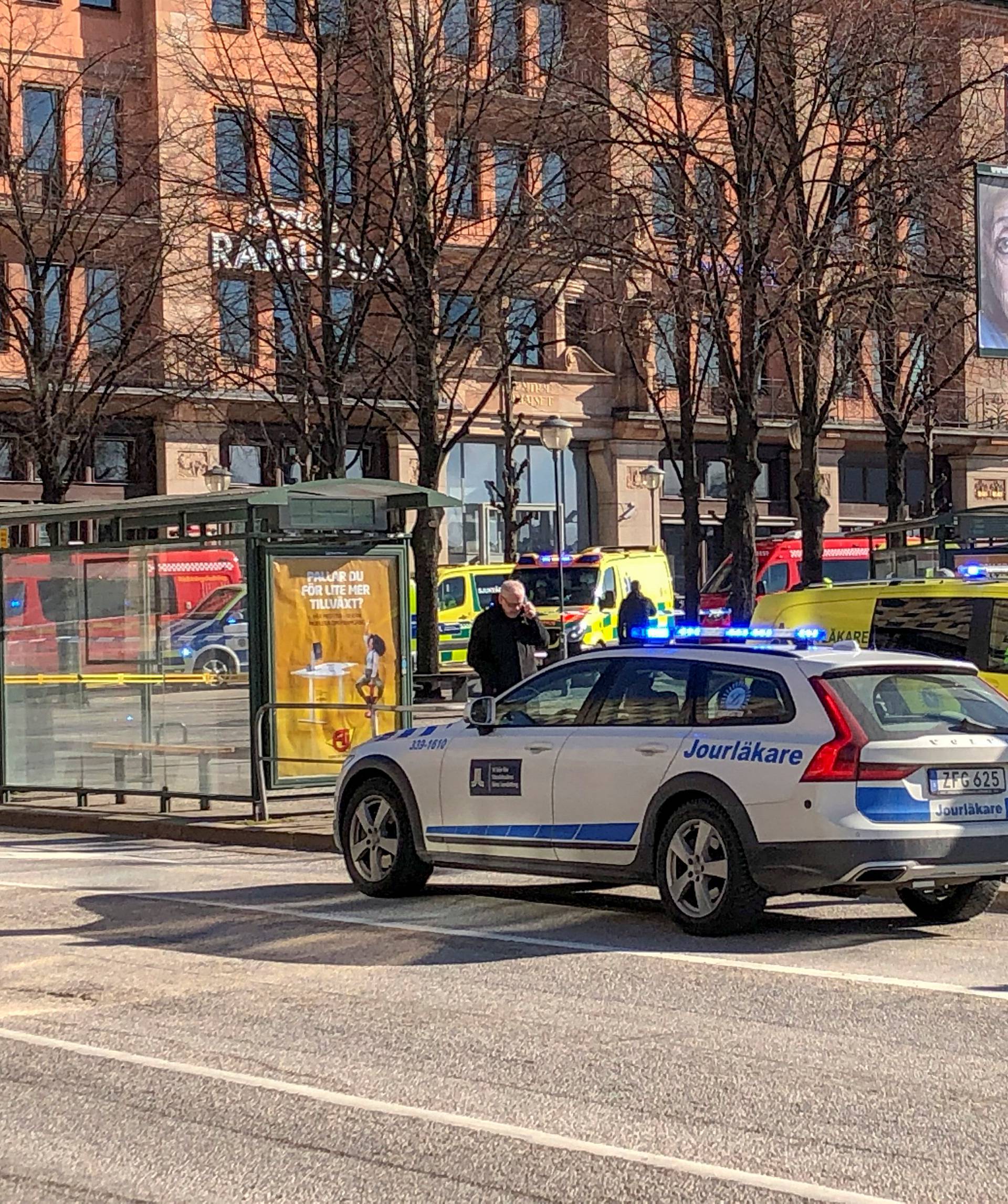 Emergency services are seen after a bus exploded and caught fire in Tegelbacken in central Stockholm