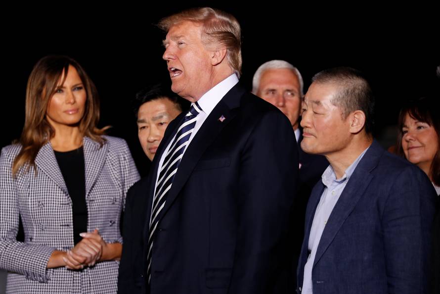 U.S.President Donald Trump speaks to the media as he meets the Americans released from detention in North Korea upon their arrival at Joint Base Andrews