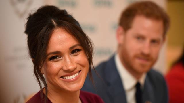 FILE PHOTO: FILE PHOTO: Britain's Meghan, the Duchess of Sussex, and Prince Harry, Duke of Sussex, attend a roundtable discussion on gender equality with The Queen's Commonwealth Trust (QCT) and One Young World at Windsor Castle