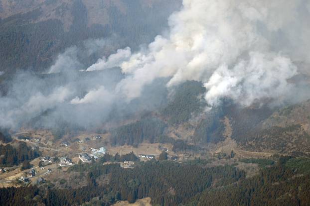 An aerial views shows a forest fire on a mountain in Ofunato, Iwate Prefecture, northeastern Japan