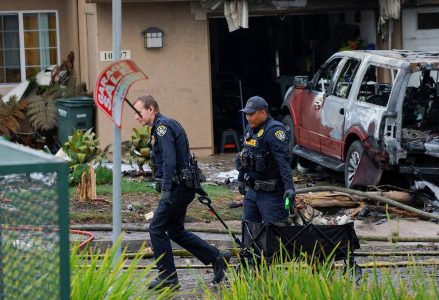Crash scene after a civilian aircraft went down in a neighborhood, in San Diego