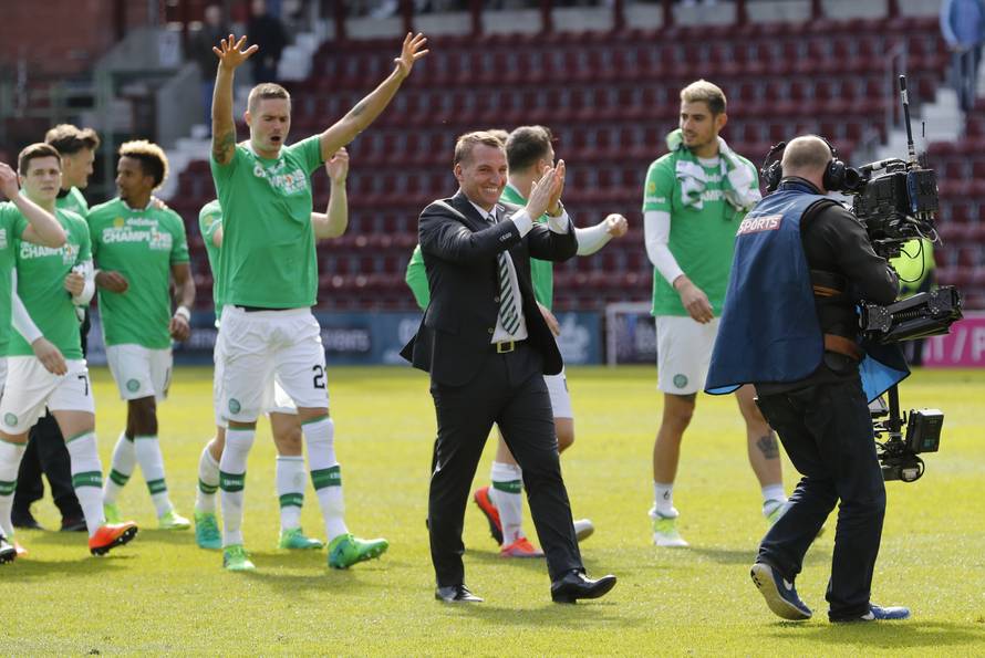 Celtic manager Brendan Rodgers and their players celebrate winning the Scottish Premiership