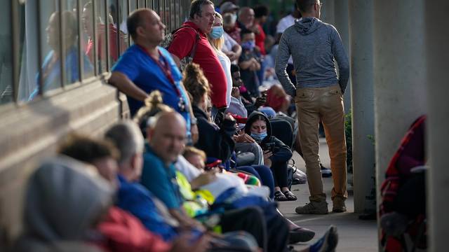 People wait outside Kentucky Career Center in Frankfort