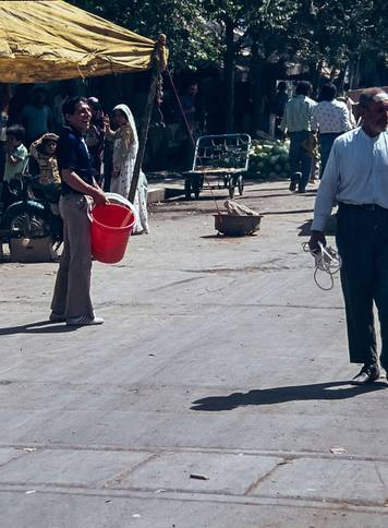 The image is of Shiraz, the 5th most populated city in Iran as it was in 1978 seen here in the souk, suq, market place. Shiraz is seen as a cultural city famed for its rose gardens, the home of the Persian Poet Saadi and the original source of the Shiraz 