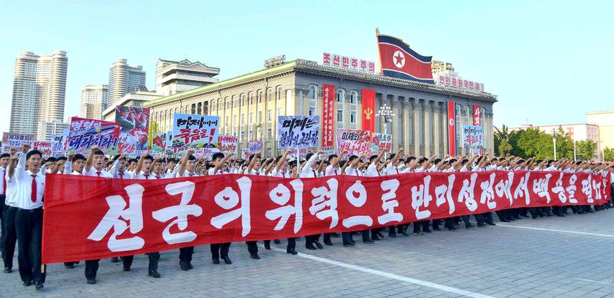 People participate in a Pyongyang city mass rally held at Kim Il Sung Square to fully support the statement of the DPRK government