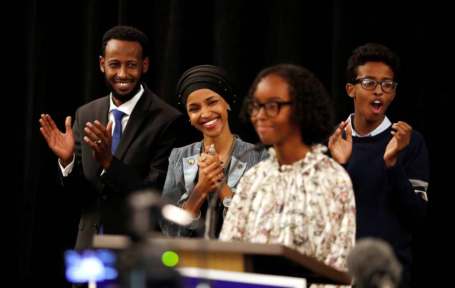 Democratic congressional candidate Ilhan Omar  listens as she is introduced by her daughter, Isra at her election night party in Minneapolis