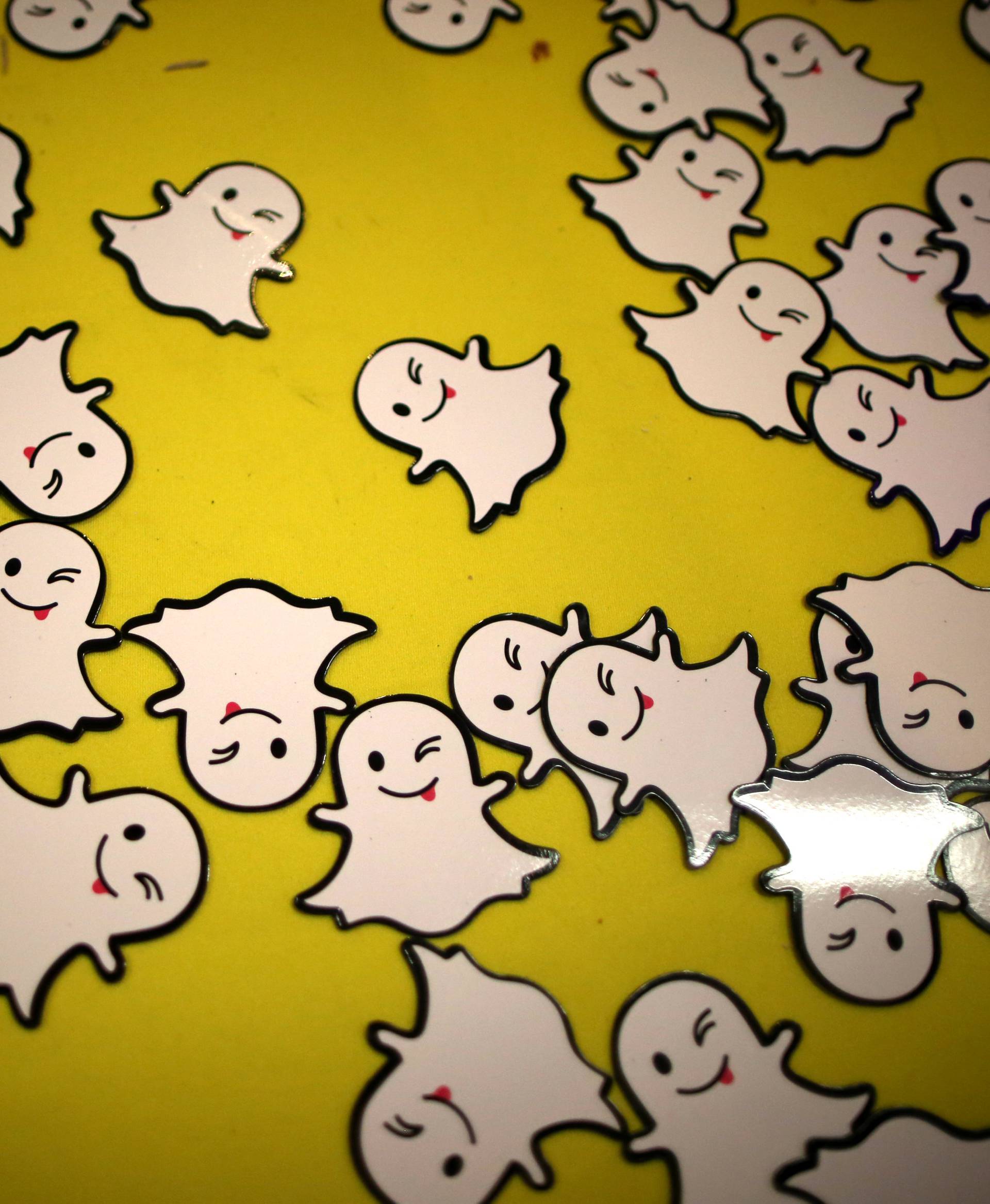 The logo of messaging app Snapchat is seen at a booth at TechFair LA, a technology job fair, in Los Angeles