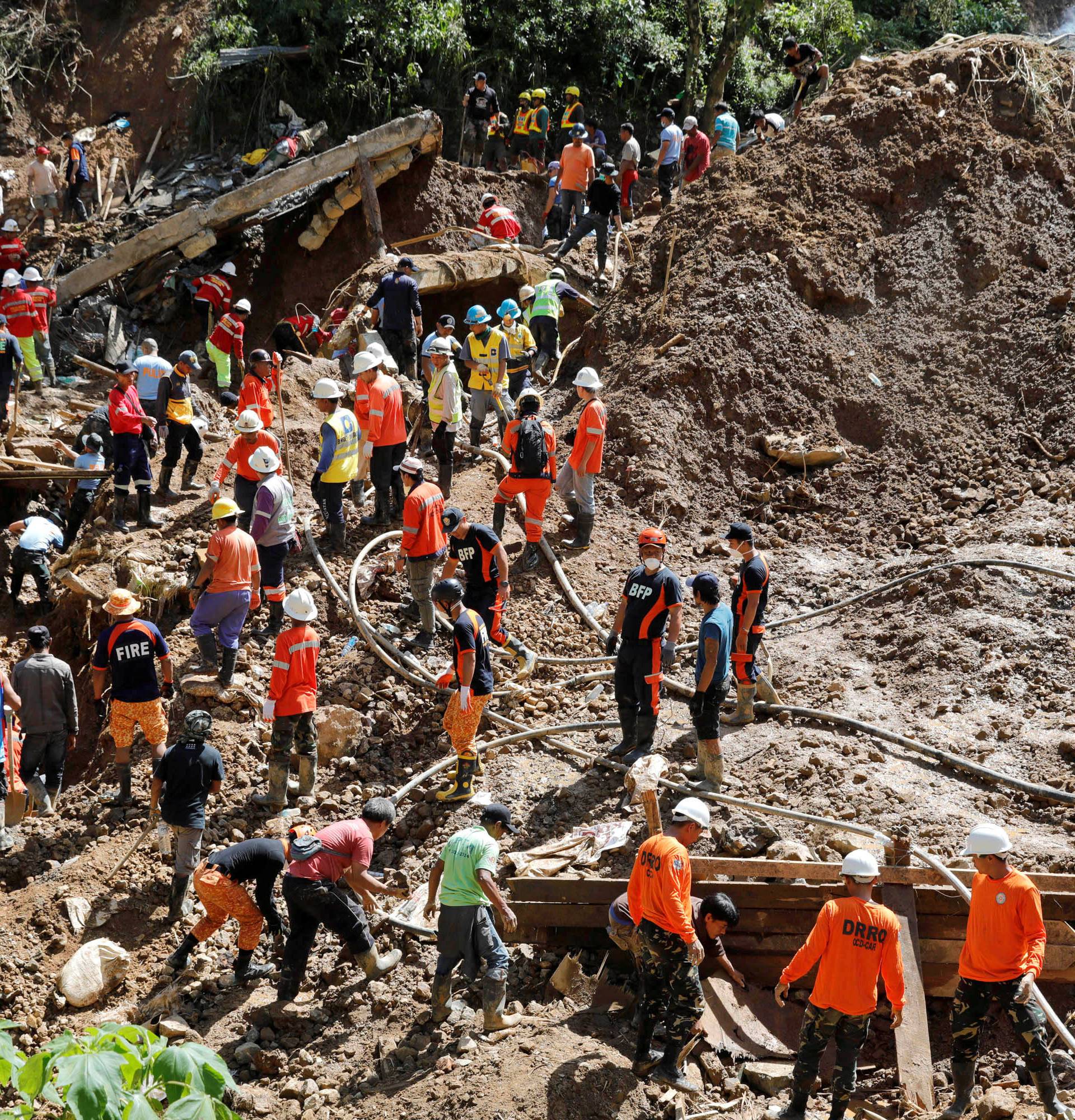 Rescuers continue their search for missing miners in a landslide caused by Typhoon Mangkhut at a small-scale mining camp in Itogon