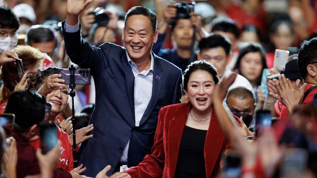 FILE PHOTO: Thai prime minister candidate Paetongtarn Shinawatra and Srettha Thavisin at a rally two days before election, in Bangkok