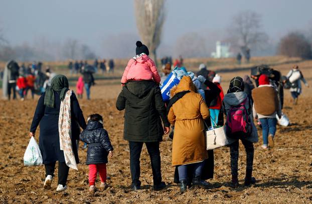Migrants walk towards the Turkey