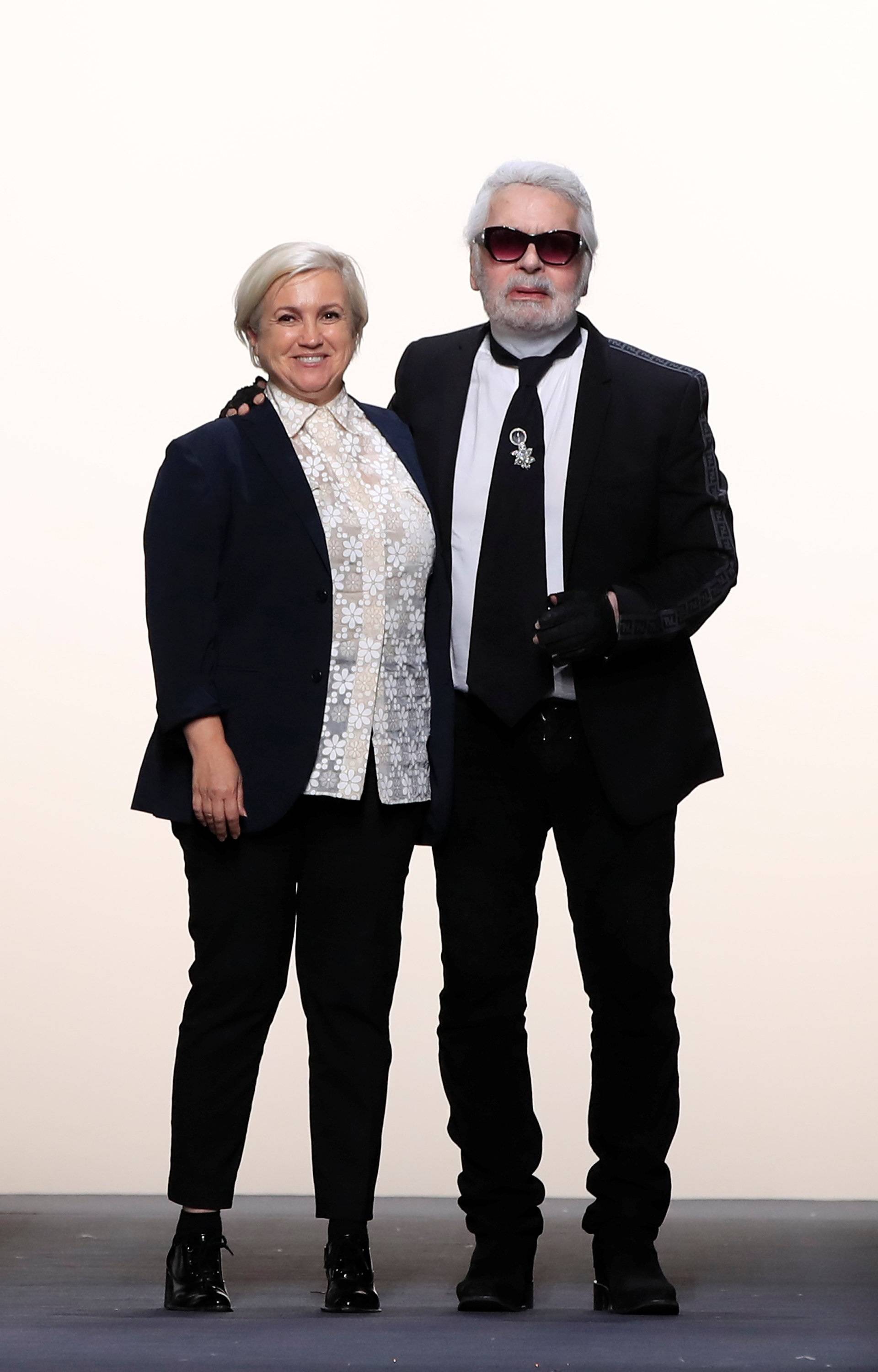 Designers Karl Lagerfeld and Silvia Venturini appears at the end of their Haute Couture Fall/Winter 2018/2019 collection show for fashion house Fendi in Paris