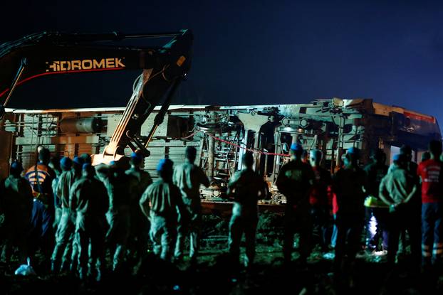 Rescue workers and paramedics work at the site of a train derailment near Corlu in Tekirdag province, Turkey