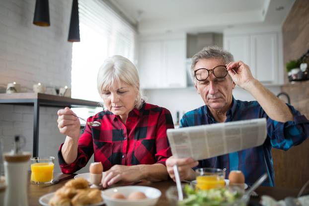 Senior marriage having morning breakfast together