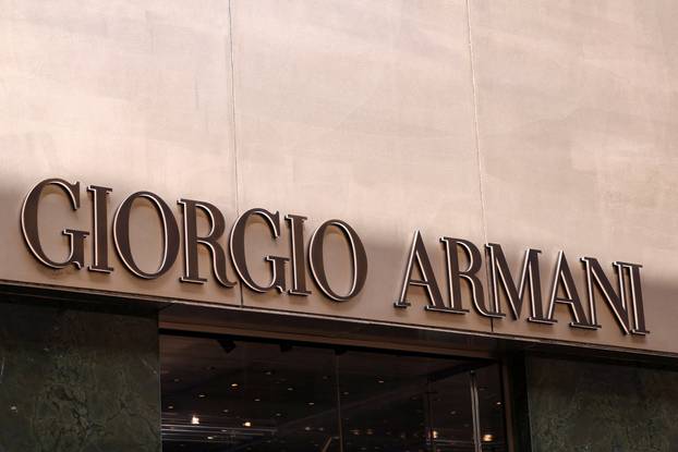 The logo of fashion house Giorgio Armani is seen outside a shop in Milan