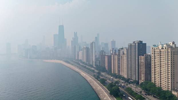 Canadian wildfire smoke shrouds the skyline in Chicago