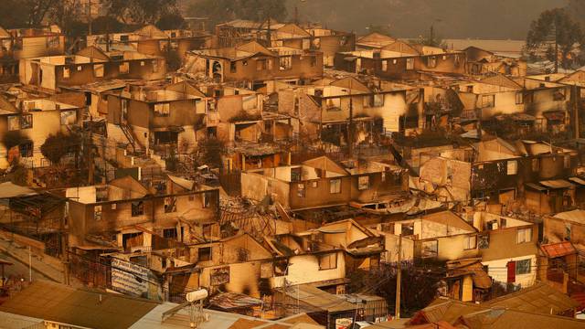 Burnt houses are pictured amid the spread of wildfires in Vina del Mar