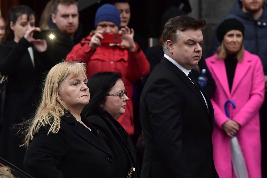 Eileen O'Riordan, mother of Dolores O'Riordan, singer with the Cranberries looks on as her daughter's coffin is brought into St. Joseph's Church for a public reposal in Limerick