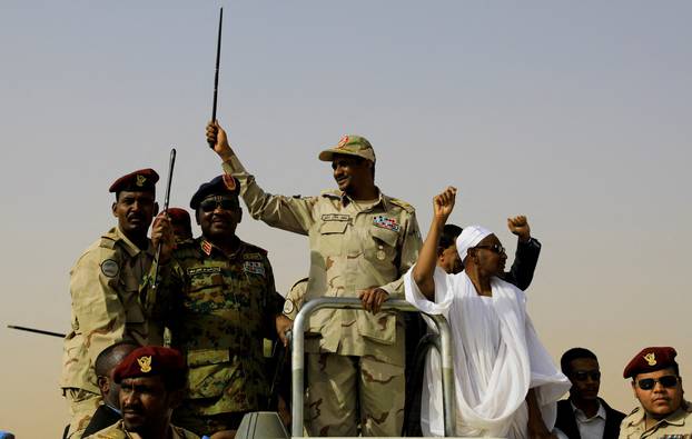 FILE PHOTO: Lieutenant General Mohamed Hamdan Dagalo greets his supporters as he arrives at a meeting in Aprag village