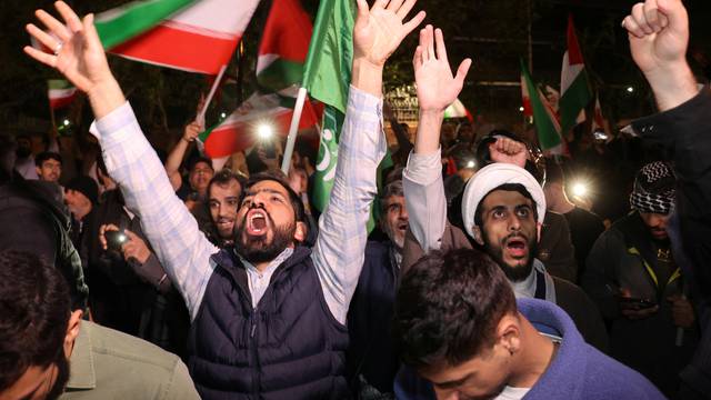 Iranians react after the IRGC attack on Israel, in Tehran